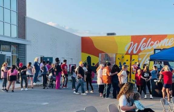 People arriving to an event at Markland Mall